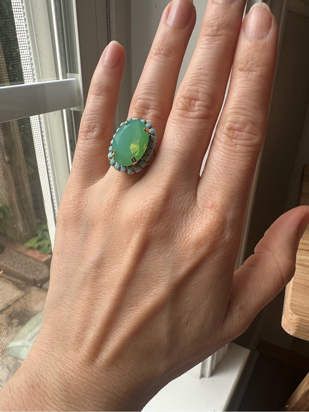 Gold Ring with Green Stone and Halo Accent